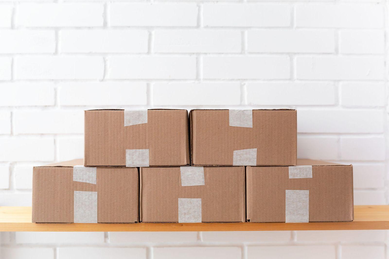 Plain brown cartons stacked on a shelf