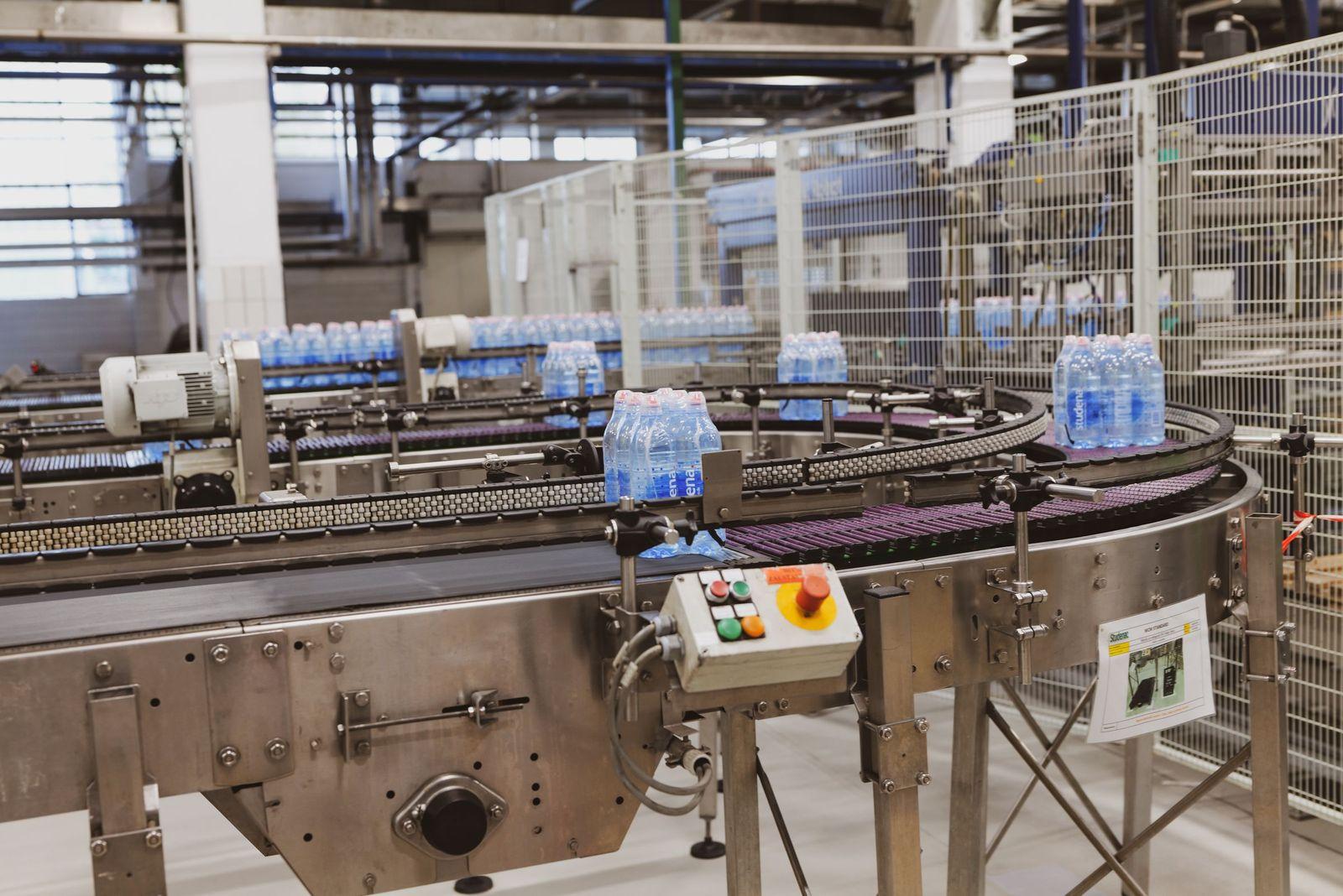 Bottles moving round a filling line