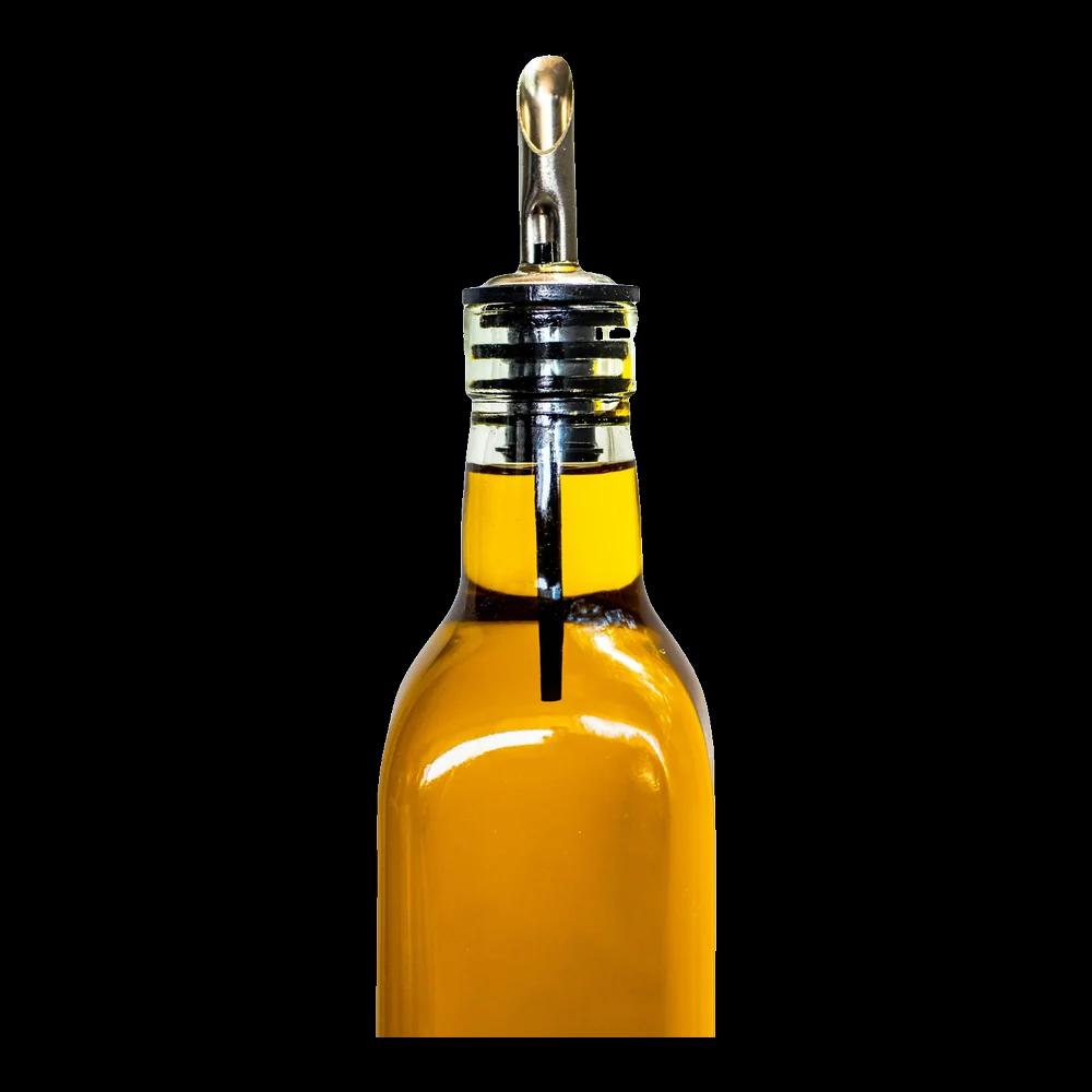 Golden oil in a glass bottle with a pourer spout